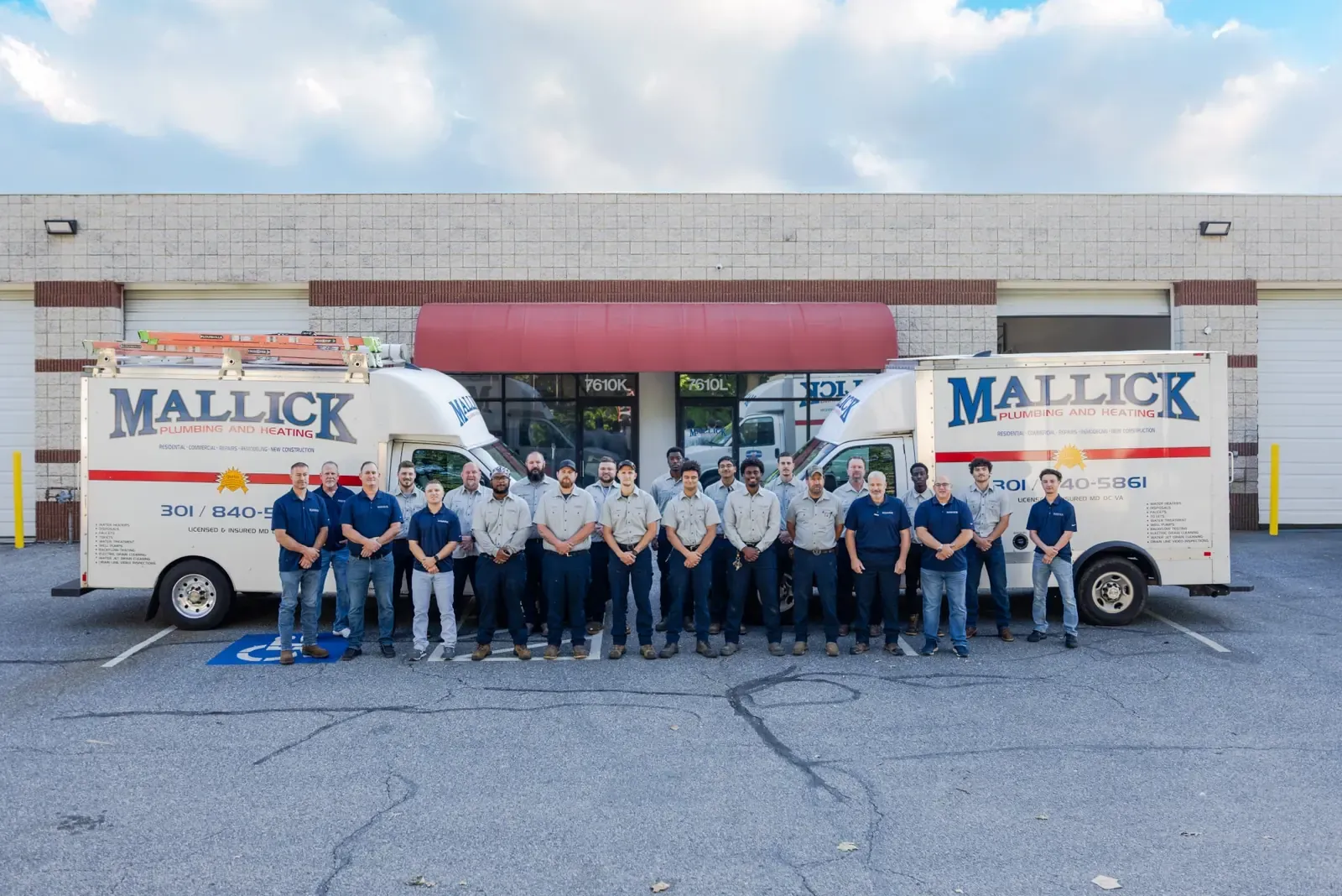 The Mallick Plumbing & Heating commercial team with service trucks