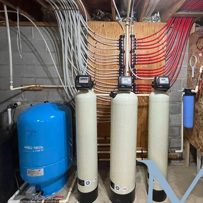 Well pressure tank and whole-house treatment system installed by Mallick